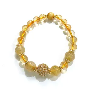 Elegante pulsera de cuarzo rutilado dorado y citrino con cuenta de filigrana de oro