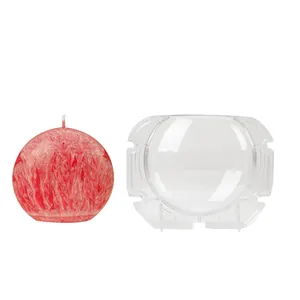 Clear PC plastic planet candle mold shown with a finished red textured wax candle