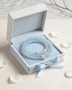 Blue chalcedony beaded bracelet with white agate ring in an elegant light blue gift box.