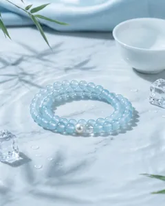 Macro view of blue chalcedony beaded bracelet with pearl and clear bead accents