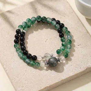 Retro stijl armband met mosagaat en zwarte obsidiaan kralen met zilveren metalen bedels