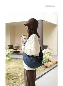 Japanese style denim dumpling bag for women, crossbody slouchy bag in trendy street style.