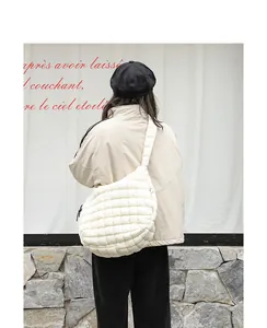 Stylish white quilted nylon shoulder bag with pleated cloud design for casual outfits