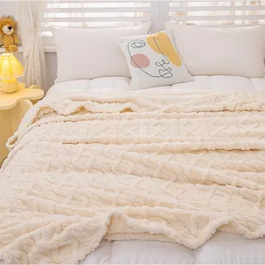 Luxurious cream tufted coral fleece blanket with geometric textures on cozy bed