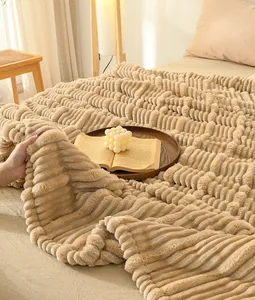Detailed macro view of the soft ribbed flannel throw blanket featuring a cozy plush texture.