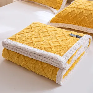 Cozy yellow thickened taffeta fleece blanket with cable knit texture and white border.