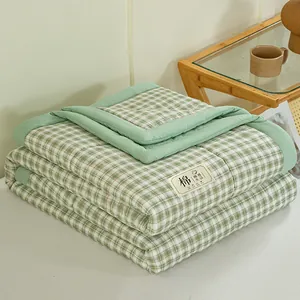 Premium washable cotton summer quilt featuring a soft green plaid pattern design