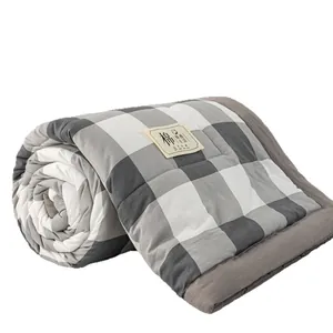 Washable cotton summer quilt with gray and white buffalo check pattern