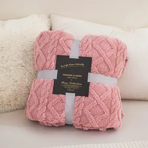Soft pink coral fleece blanket with diamond textured pattern and gift packaging