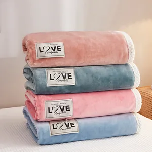 Soft thick double-layer milk velvet flannel blankets stacked in multiple colors