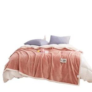 Thick pink milk velvet flannel blanket with decorative LOVE label for cozy winter use
