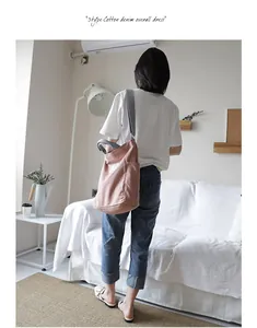 Minimalist casual pink canvas shoulder bag for women in a lifestyle home setting