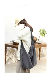Casual dark grey corduroy crossbody bag with stylish knot strap detail on model