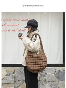 Brown quilted nylon shoulder bag shown in a street style lifestyle fashion setting