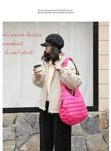 Fashionable pink quilted nylon shoulder bag shown in a casual street style setting