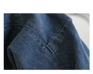 High-quality close-up showing the durable blue denim fabric and stitching on a bag