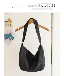 Minimalist black pleated nylon hobo bag for women with wide adjustable shoulder strap