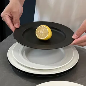 Minimalist black and white ceramic dinner plates with textured edges for steak and dessert