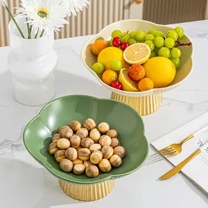Elegant plum blossom ceramic fruit platter with a luxury golden fluted pedestal stand