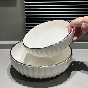 Large minimalist white ceramic noodle and soup bowl set with black rim and fluted texture