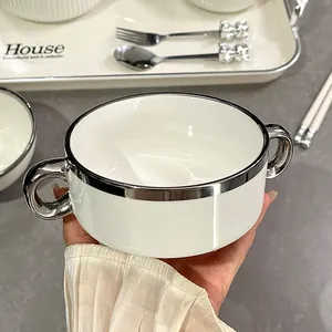 Elegant white ceramic bowl featuring a silver rim and double handles for dessert and soup