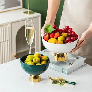 Luxury ceramic pedestal fruit bowl with ribbed texture and elegant gold base for home decor