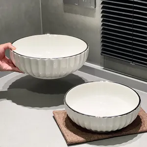 Minimalist large white ceramic bowl set with silver rim and elegant ribbed texture