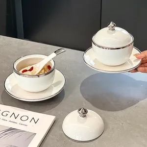 Elegante juego de ollas de cerámica blanca con borde plateado para sopa, postre o nido de pájaro