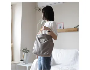 Casual large capacity canvas tote bag for women shown in a bright lifestyle setting