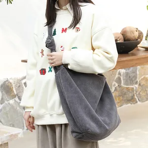 Minimalist casual grey corduroy crossbody bag with a stylish knotted shoulder strap design