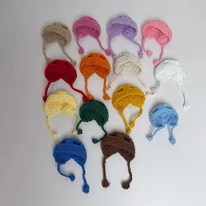 Collection of colorful handmade crochet miniature doll hats with adjustable straps