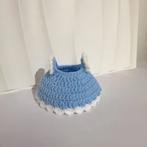 Detailed close-up of light blue hand-crocheted princess dress for 20cm plush doll