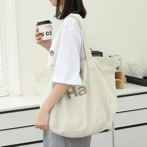 Minimalist vintage washed canvas tote bag with large letter print for women's daily use