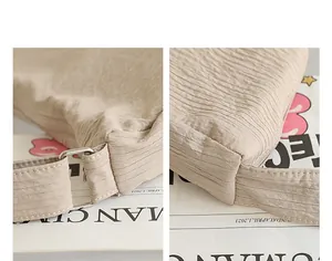 Macro detail view of beige pleated fabric texture and stitching on nylon shoulder bag