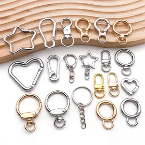 Various metal keychain hardware in star, heart, and round shapes, silver and gold finishes