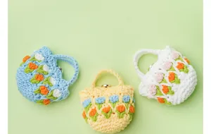 Hand-knitted tulip crochet pouches for earphones in blue, yellow, and white colors