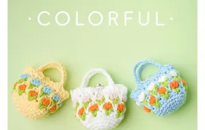 Macro detail of handmade crochet tulip earphone bags in yellow white and blue