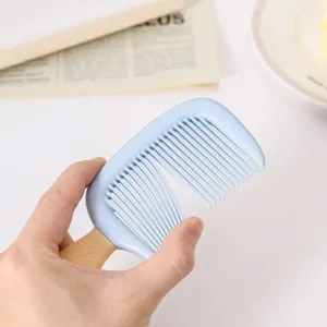 Detail of flexible anti-static ice cream shaped children's comb with smooth blue teeth