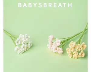 Detailed view of handmade crochet baby breath flowers in pastel pink white and yellow