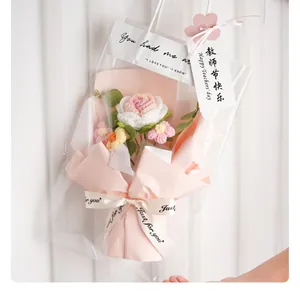 Handmade crochet rose flower bouquet in pink wrapping paper and clear gift bag