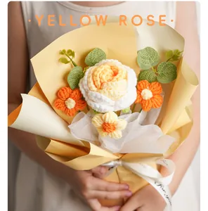 Close-up of a handmade crochet flower bouquet with yellow and white roses for gift.