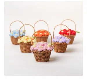 Close-up of colorful handmade crochet puff flowers in mini woven baskets