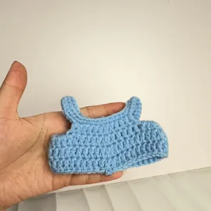 Sky blue hand-knitted miniature vest accessory designed for 12cm plush cotton dolls