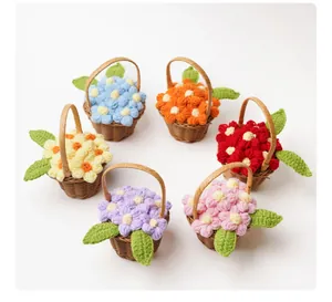 Macro view of six handmade crochet mini puff flower baskets in varied colors.