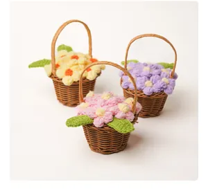 Set of three handmade knitted mini puff flower baskets in yellow, pink and purple
