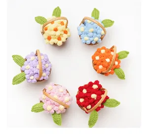 Detailed view of six colorful handmade crochet mini puff flower baskets in a circle