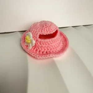 Handmade pink knitted pet hat with ear holes and decorative flower for cats and dogs