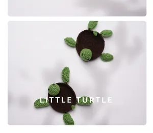 Hand-knitted crochet turtle coasters on a white surface with soft shadows
