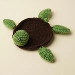 Hand-knitted wool turtle coaster for creative home decor and stylish tabletop protection