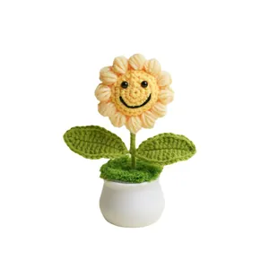 Crochet sunflower potted plant with smiling face decoration